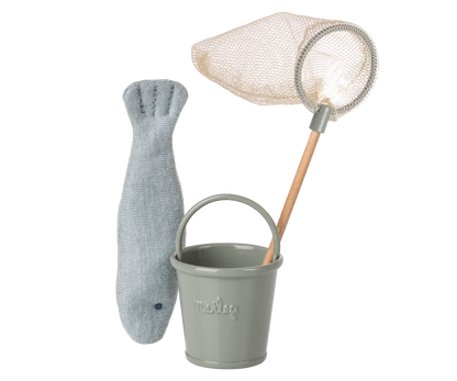 A children's fishing toy set featuring a gray fish-shaped net, a small gray bucket with the brand name 'TraLeg' embossed on the front, and a beige mesh fishing net with a wooden handle, all photographed on a clean white background.