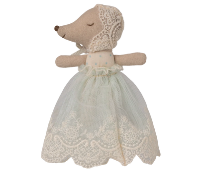 Stuffed animal toy with a lace dress on a white background