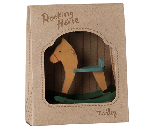 A wooden rocking horse toy in its original brown kraft paper packaging box, featuring a window cutout that displays the toy. The brand name 'Marley' is printed on the bottom right of the box.