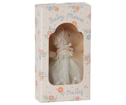 A baby mouse doll dressed in a white lace and tulle gown, presented inside its floral-patterned packaging box with the name 'Marig' printed on it.