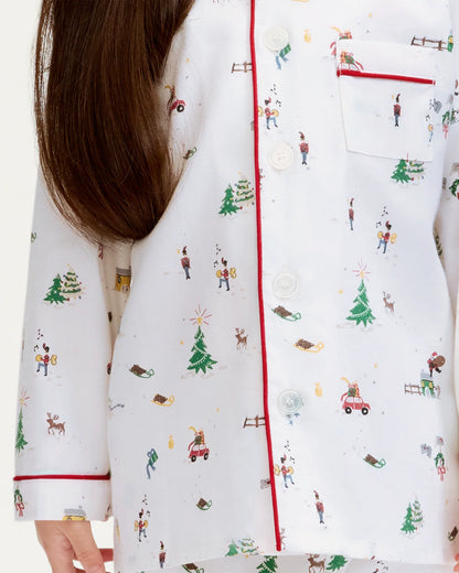 White robe with Christmas-themed pattern worn by a person