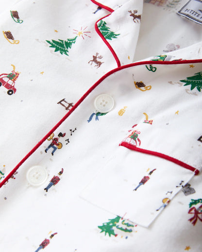 Christmas-themed fabric with reindeer, trees, and candy canes on a white background.