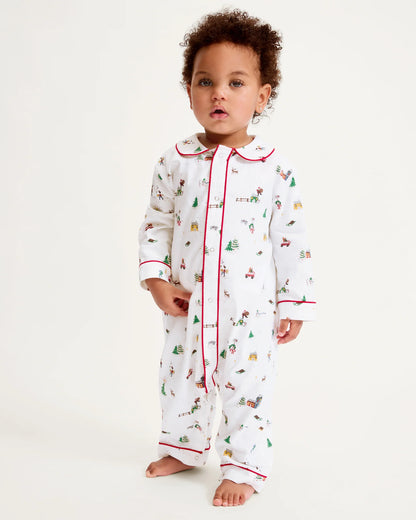 Baby wearing a festive onesie with a white background