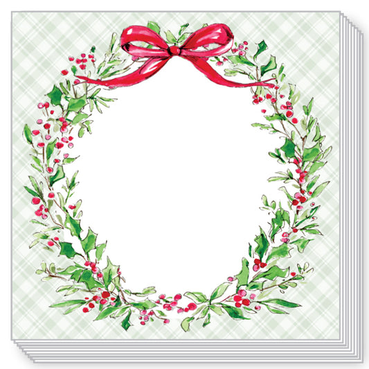A stack of square greeting cards or paper products shown on a white background. The top card features a watercolor-style holiday wreath with green leaves, red berries, and a red bow on a pale green plaid background.