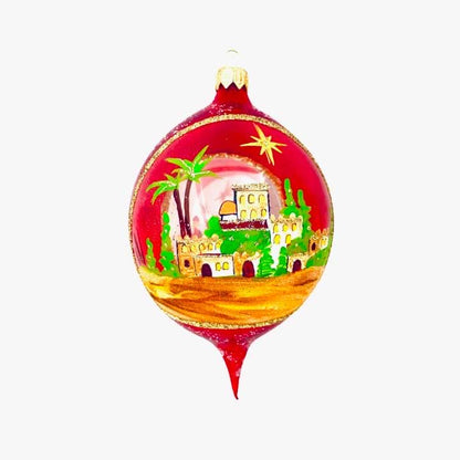 Decorative Christmas ball with a palm tree and building design on a white background