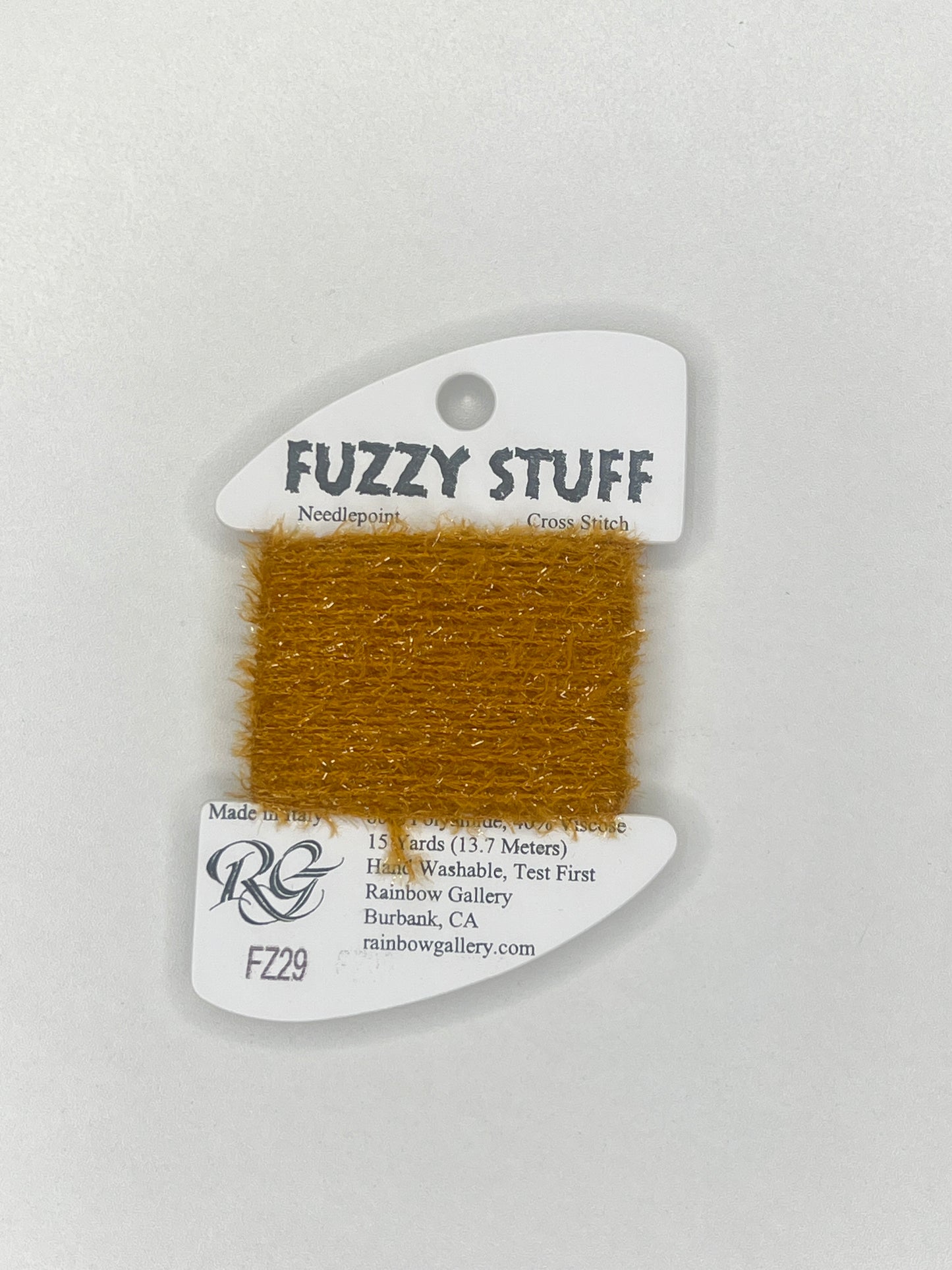 Gold fuzzy material on a white card with 'Fuzzy Stuff' branding on a light gray background