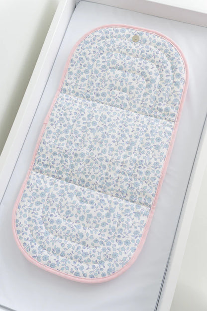 Floral-patterned eye mask on a white background