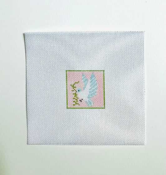 Cross-stitched design on fabric with a light blue background