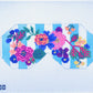 Cross-stitched floral design on a grid background