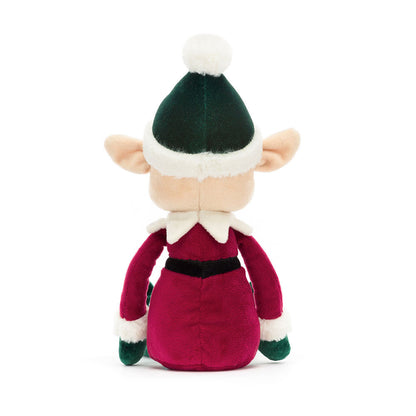 Plush elf toy with green hat and red outfit on a white background