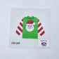Cross-stitched design of a green shirt with a Santa Claus face on a white background, featuring 'Stitch-Its' and 'KCN Designers' logos.