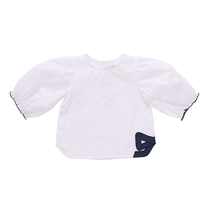 White baby bib with navy trim on a white background