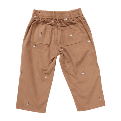 Brown pants with decorative elements on a white background