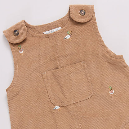 Brown corduroy romper with button details on a white background