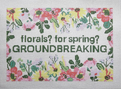 needlepoint pattern with floral design and text 'florals? for spring? GROUNDBREAKING'.