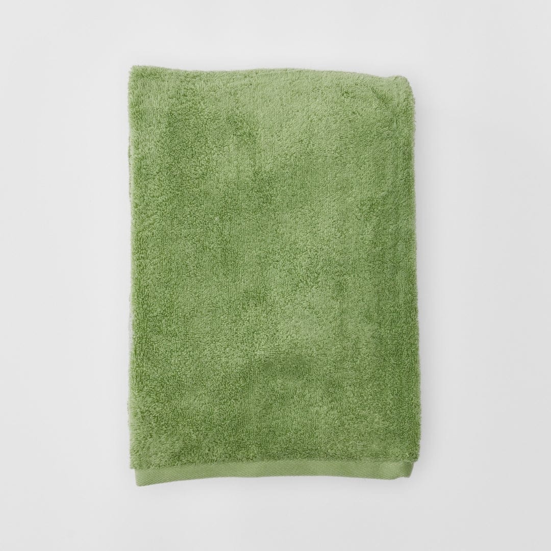 Green towel on a white background