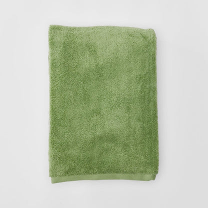 Green towel on a white background