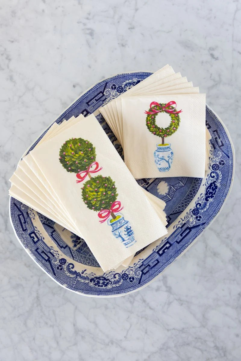 Napkins with decorative designs on a blue and white plate
