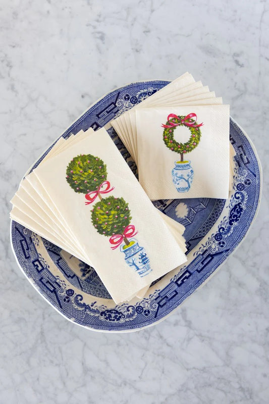 Napkins with decorative designs on a blue and white plate