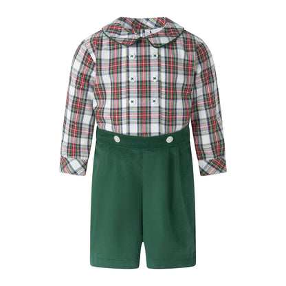 Children's outfit with plaid shirt and green shorts on a white background