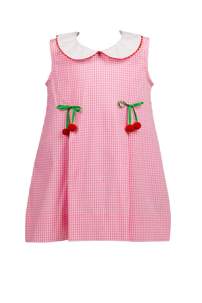 Pink checkered dress with white collar and cherry details on a white background