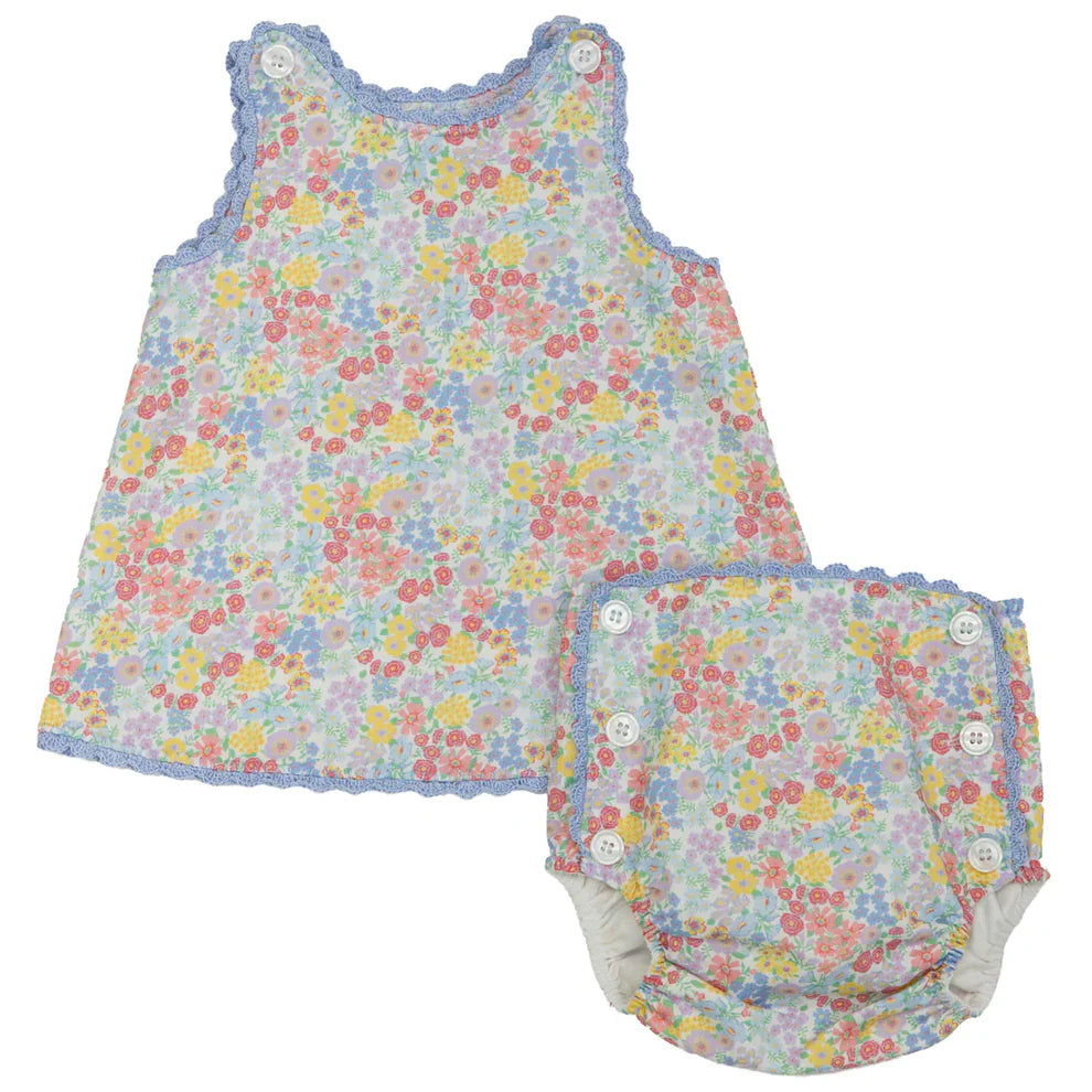 Floral baby dress and bloomers set on a white background