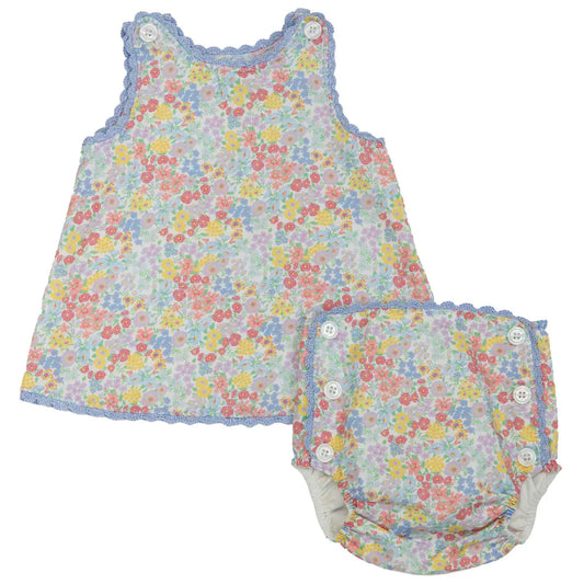 Floral baby dress and bloomers set on a white background