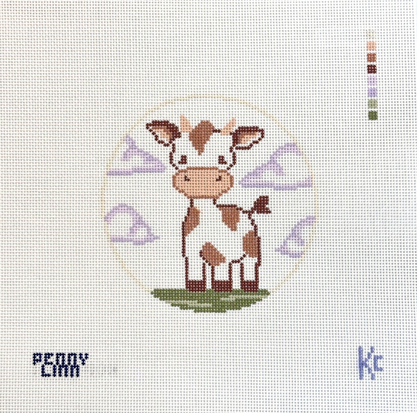 A needlepoint canvas featuring a cartoon cow design in the center, with the text 'PENNY LINN' in the bottom left and a small 'kc' mark in the bottom right, on a white mesh grid background.