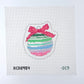 Cross-stitched design of a colorful striped ball with a pink bow on a white background.