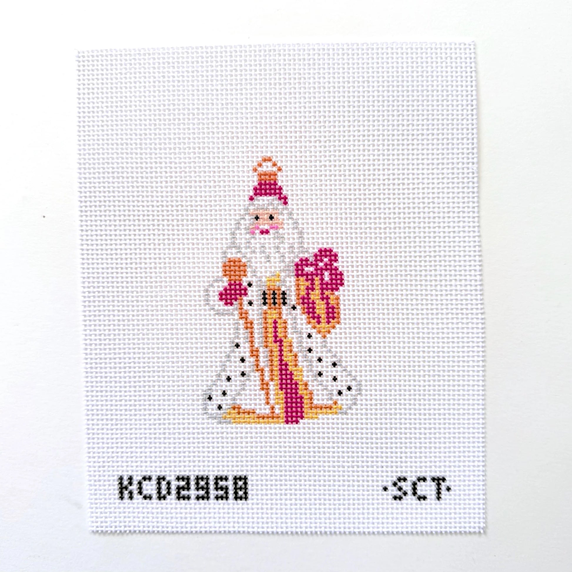 Cross-stitched design of a Santa Claus figure on a white background