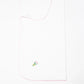 White pocket square with a floral embroidery on a white background