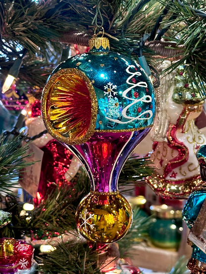 Decorative Christmas ornament on a tree with colorful design