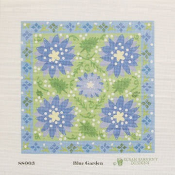 Pattern for cross-stitching with blue flowers on a green background, featuring the brand 'Susan Roberts Designs'.