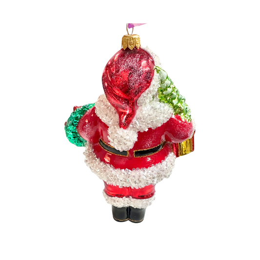 Decorative glass ornament of Santa Claus holding a red sack on a white background