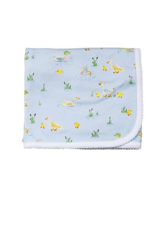 Baby blanket with duck pattern on a light blue background