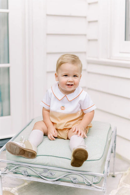 Child sitting on a transparent chair with a white background