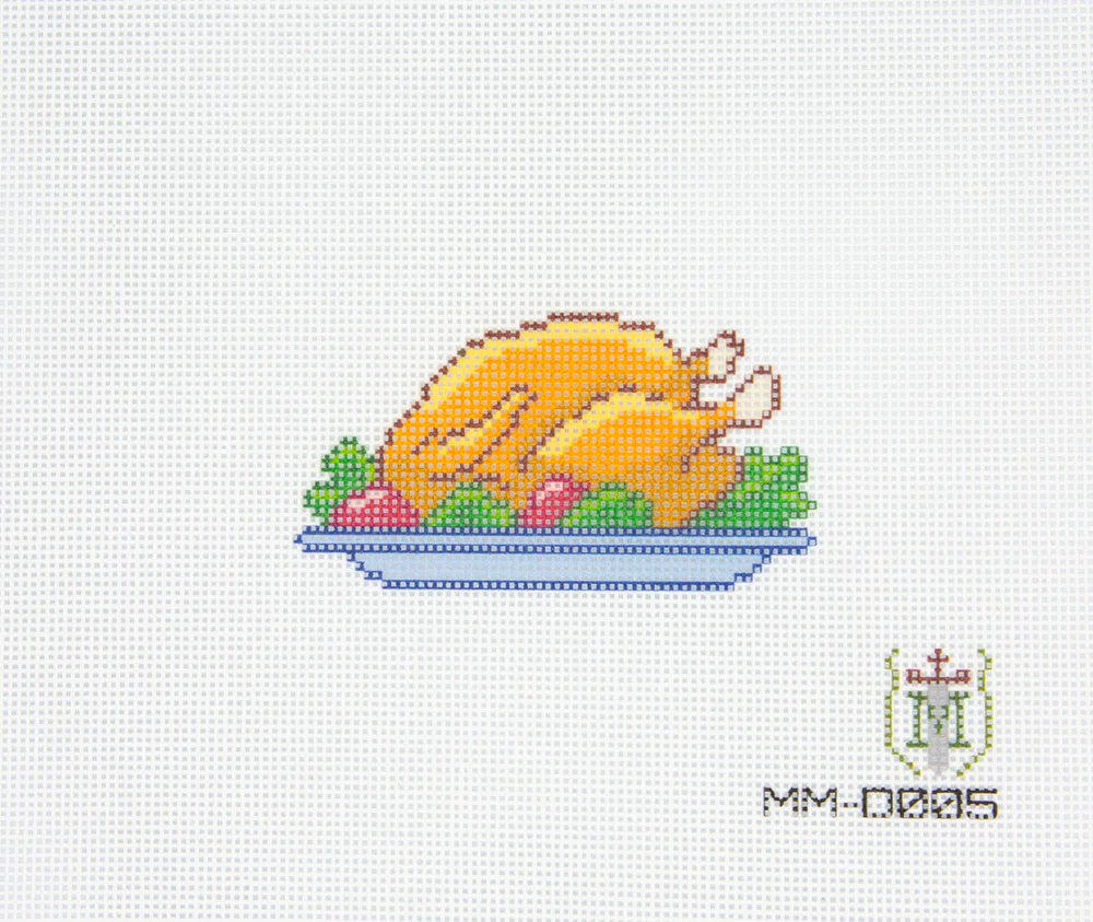 Cross-stitched pattern of a roasted turkey on a plate with vegetables on a white background.