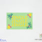 Cross-stitched design with 'Jingle Jingle Jingle' text on a green background