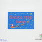 Cross-stitch pattern with 'Santa stop here' text and reindeer on a blue background