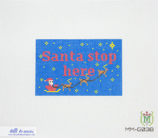 Cross-stitch pattern with 'Santa stop here' text and reindeer on a blue background