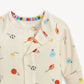 Baby onesie with sports-themed print on a white background