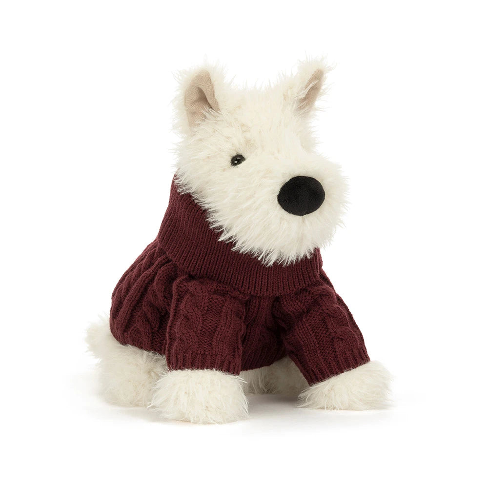 A plush West Highland terrier dog toy wearing a burgundy cable-knit sweater, set against a plain white background.
