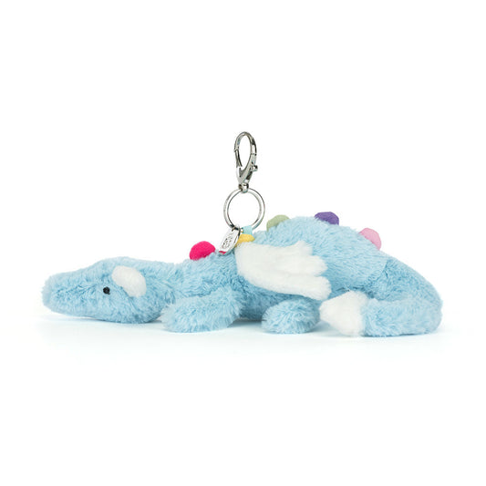 Plush blue dinosaur keychain with colorful accents on a white background