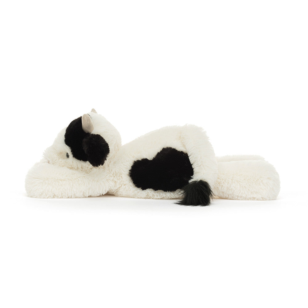 Plush toy resembling a cat with black and white fur on a white background