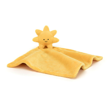 A plush toy in the shape of a sun with a smiling face, attached to a golden security blanket or soother.