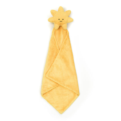 A plush toy in the shape of a sun with a smiling face, attached to a golden security blanket or soother.