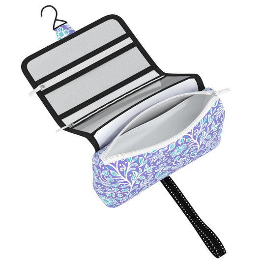 Roll-up travel organizer with floral pattern on a white background