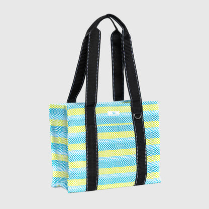 Striped tote bag with black handles on a light gray background