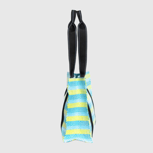 Blue and yellow striped dog toy with black handles on a light gray background