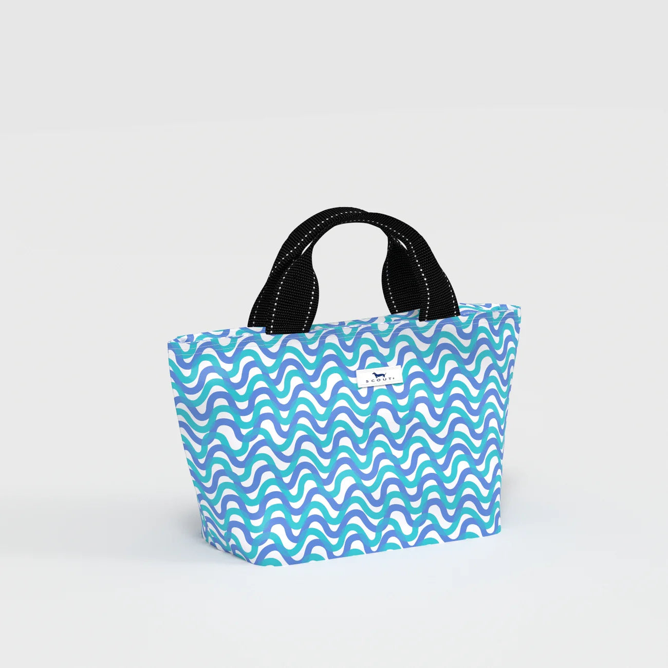 Blue and green wavy patterned bag with black handles on a light gray background
